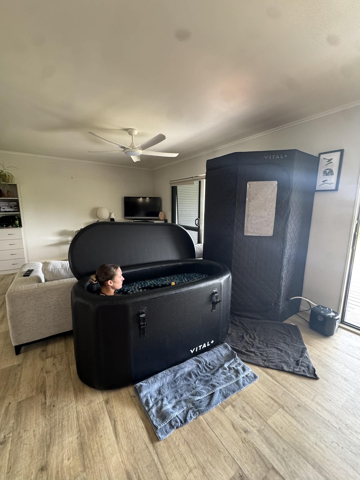 A portable sauna tent set up in a lounge